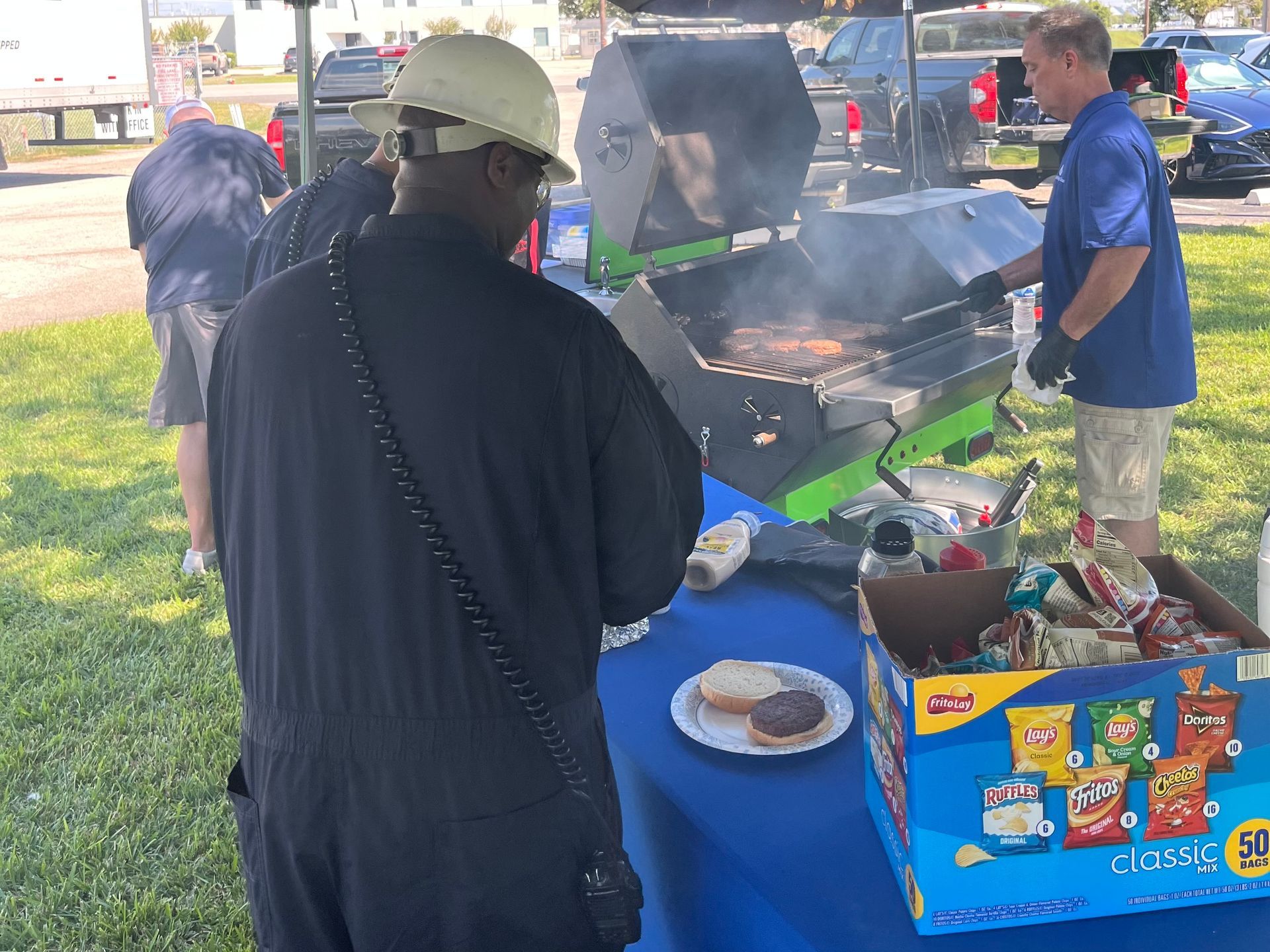 Sparkling Clear Industries serving burgers out of our Green Monster Cook Trailer