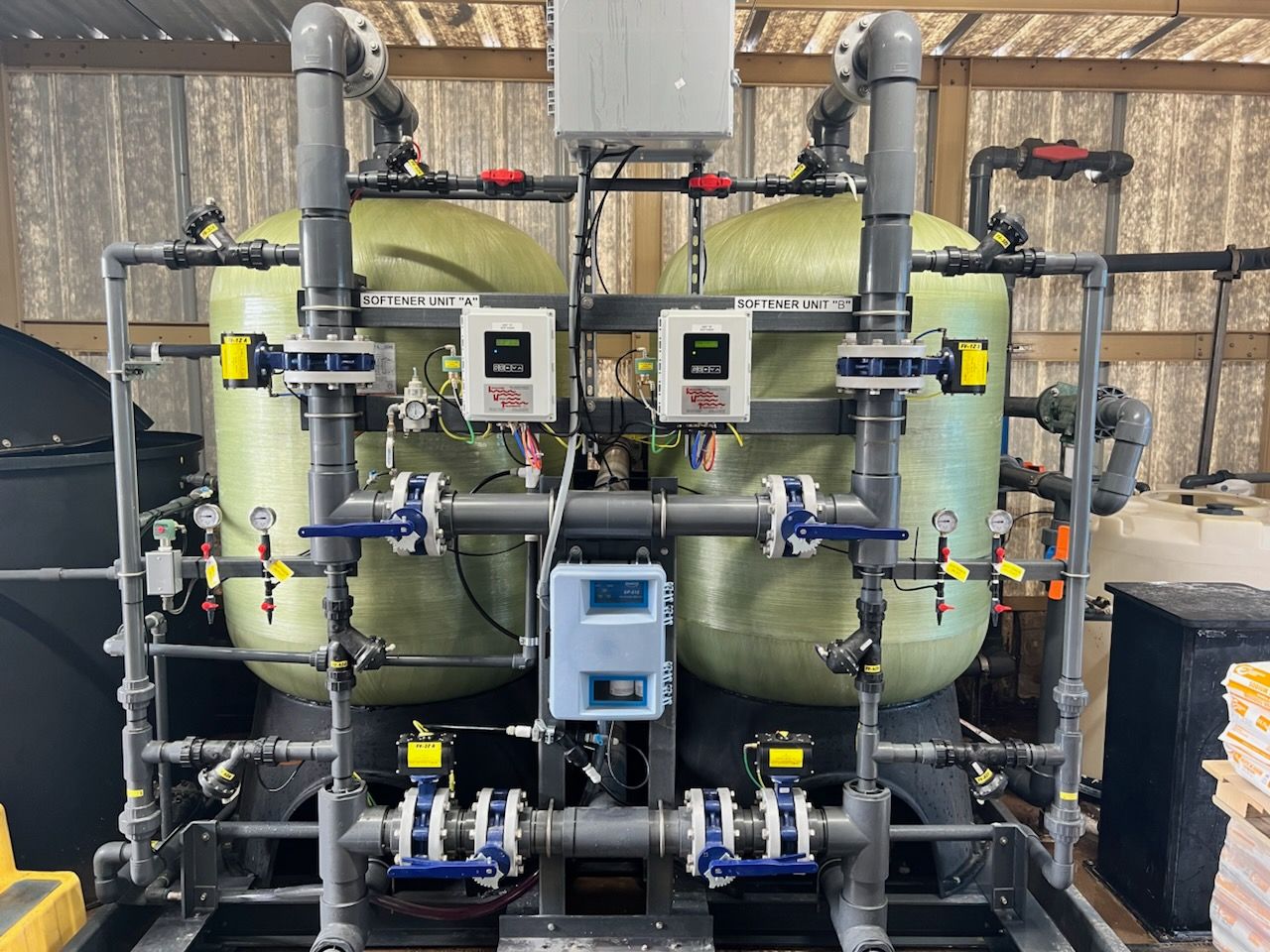 twin alternating water softener with fiberglass vessels and fiberglass skid