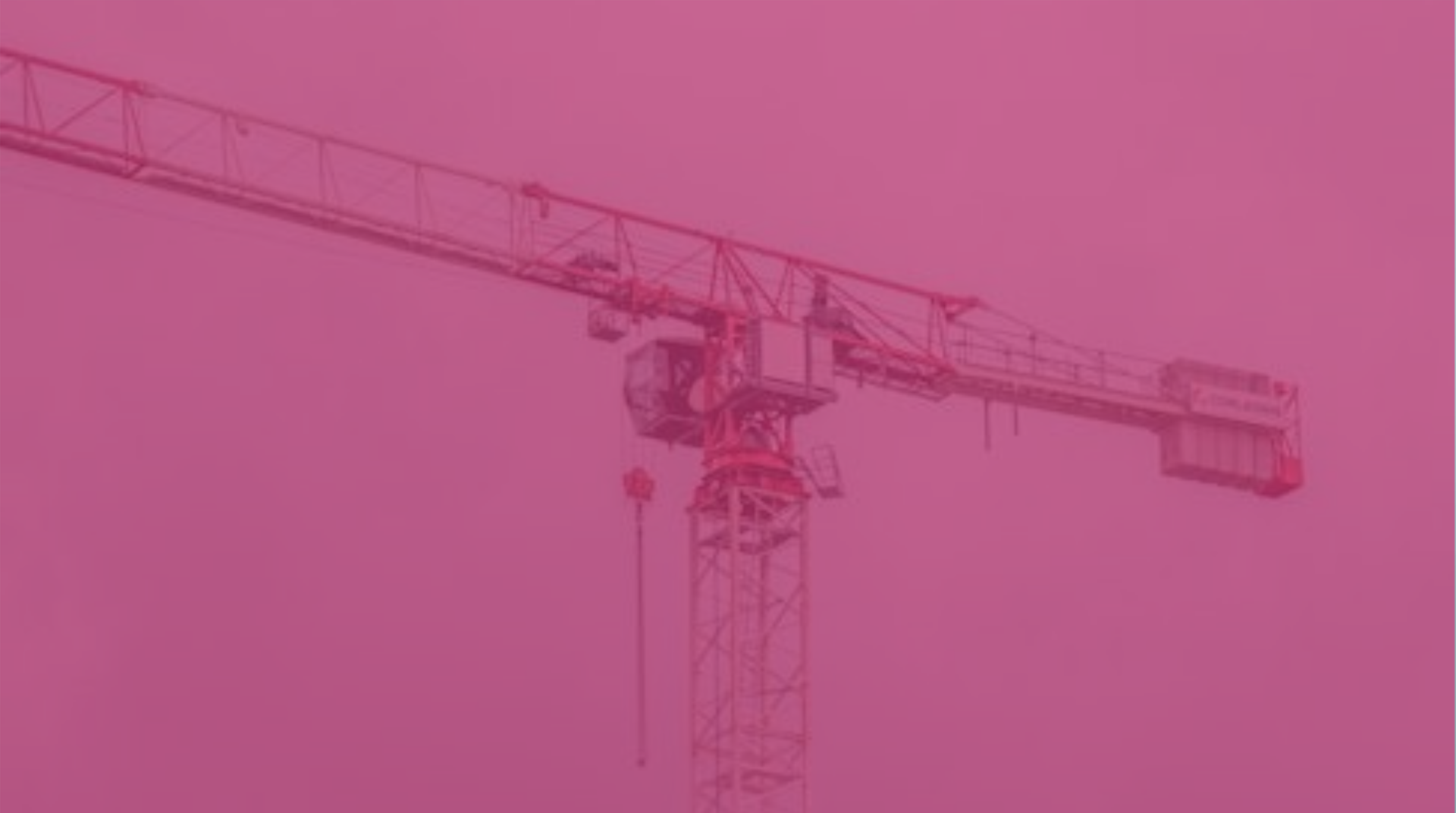 Pink-tinted construction crane against the sky