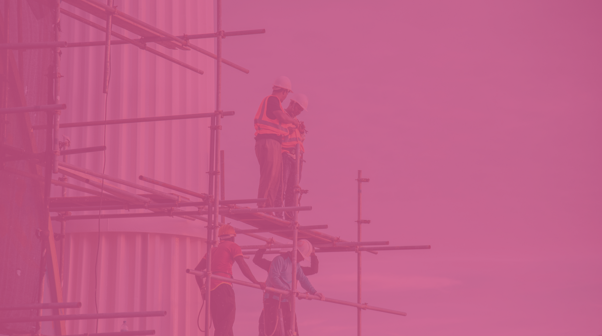 Construction worker on scaffolding beside a building, tinted pink in the scene.