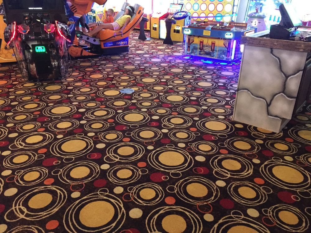 A carpet with circles on it in an arcade