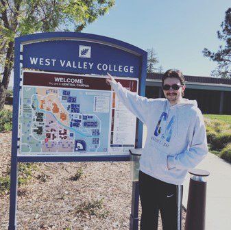 CAA student pointing to map showing CAA at West Valley College