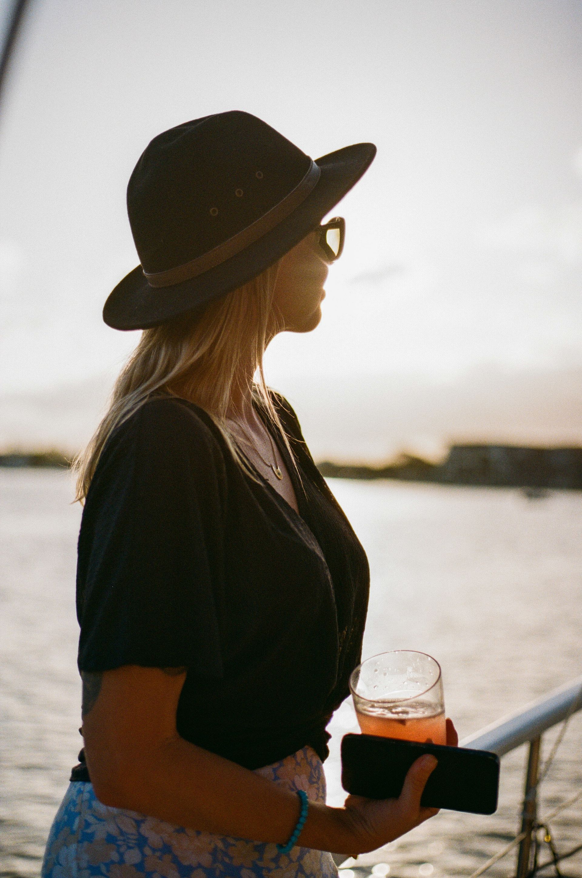 Saltwater Eco Tours Private Charters, Sunset, Woman holding drink, Mooloolaba 