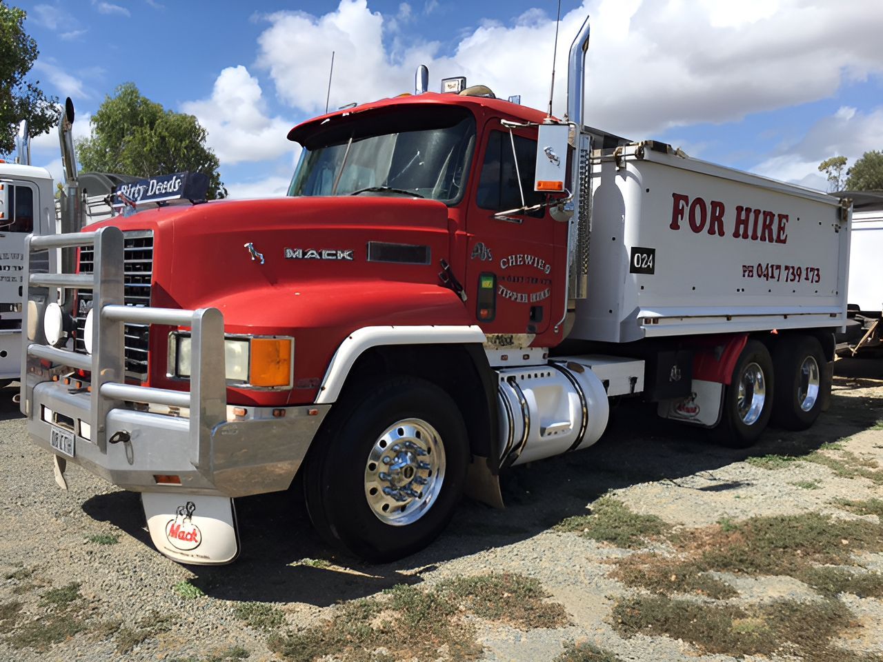 Red Mack truck with silver accents and