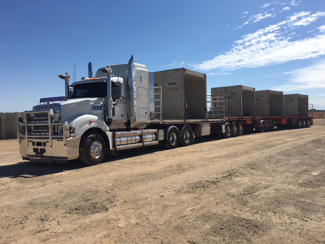Two Semi Trucks Are Parked Next to Each Other — Chewies Tipper Hire & Haulage in Gracemere, QLD