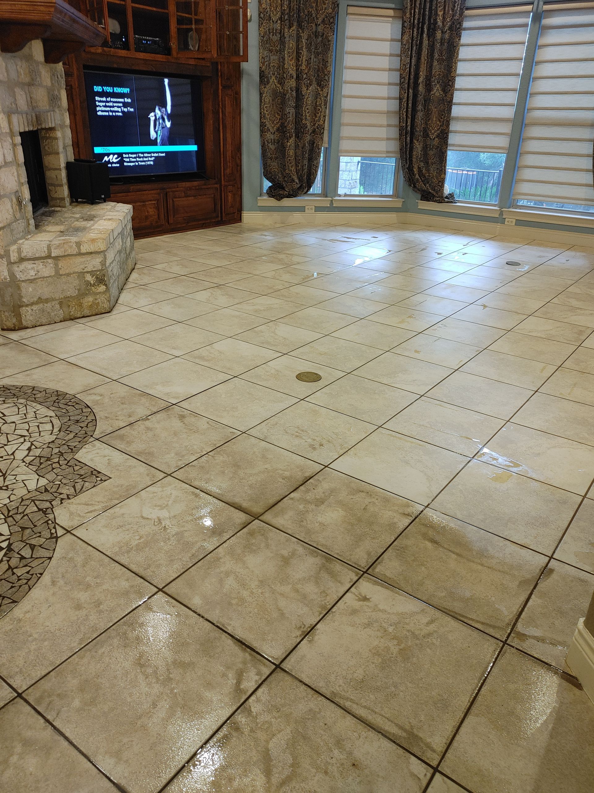 A close up of a tiled floor with black lines