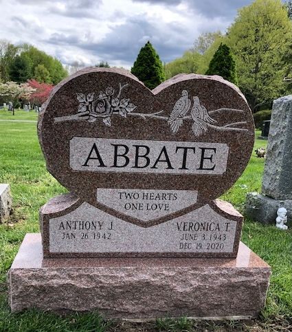 A heart-shaped granite tombstone with 