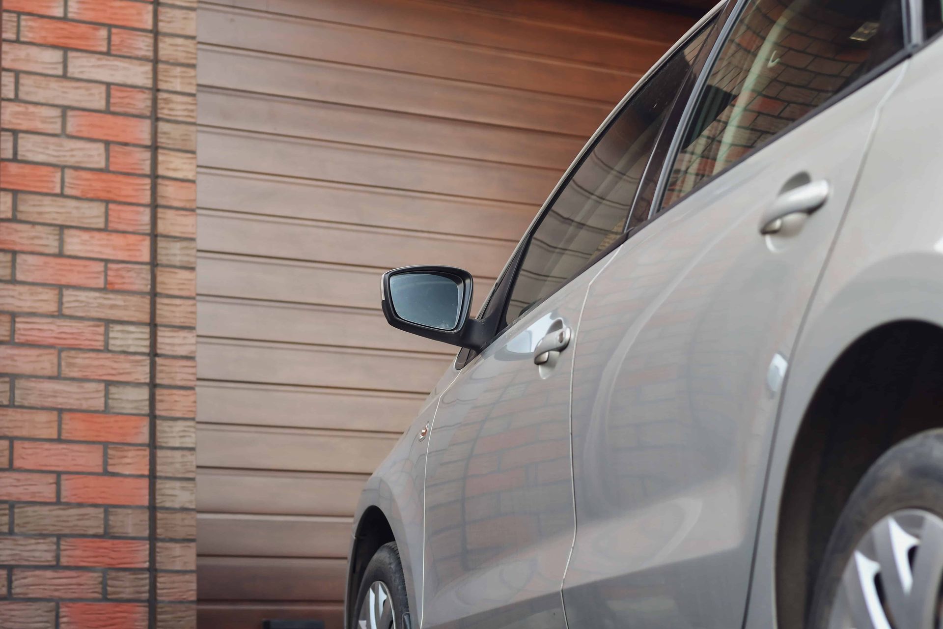 A car waiting outside a garage door