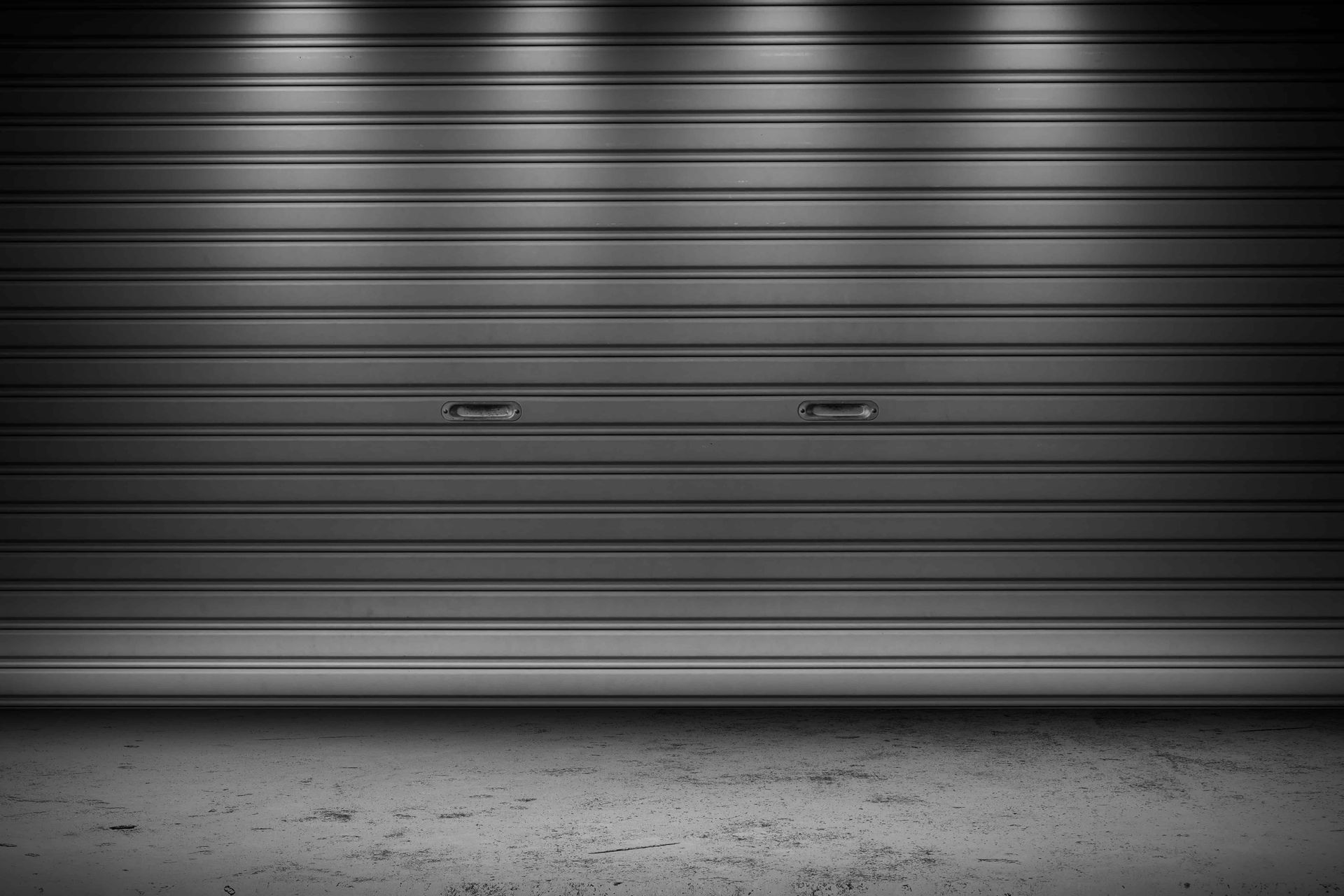 A grey commercial garage door in Surprise, Arizona