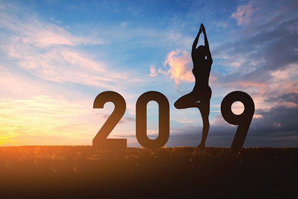 a silhouette of a person standing in front of the number 2019 .