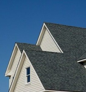 A White House with A Gray Roof and A Blue Sky in The Background | Detroit, MI | Yellow Rose Builders