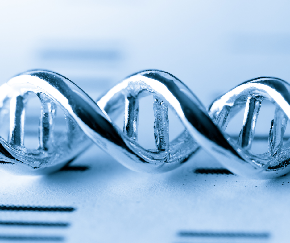 A close up of a silver dna structure on a piece of paper