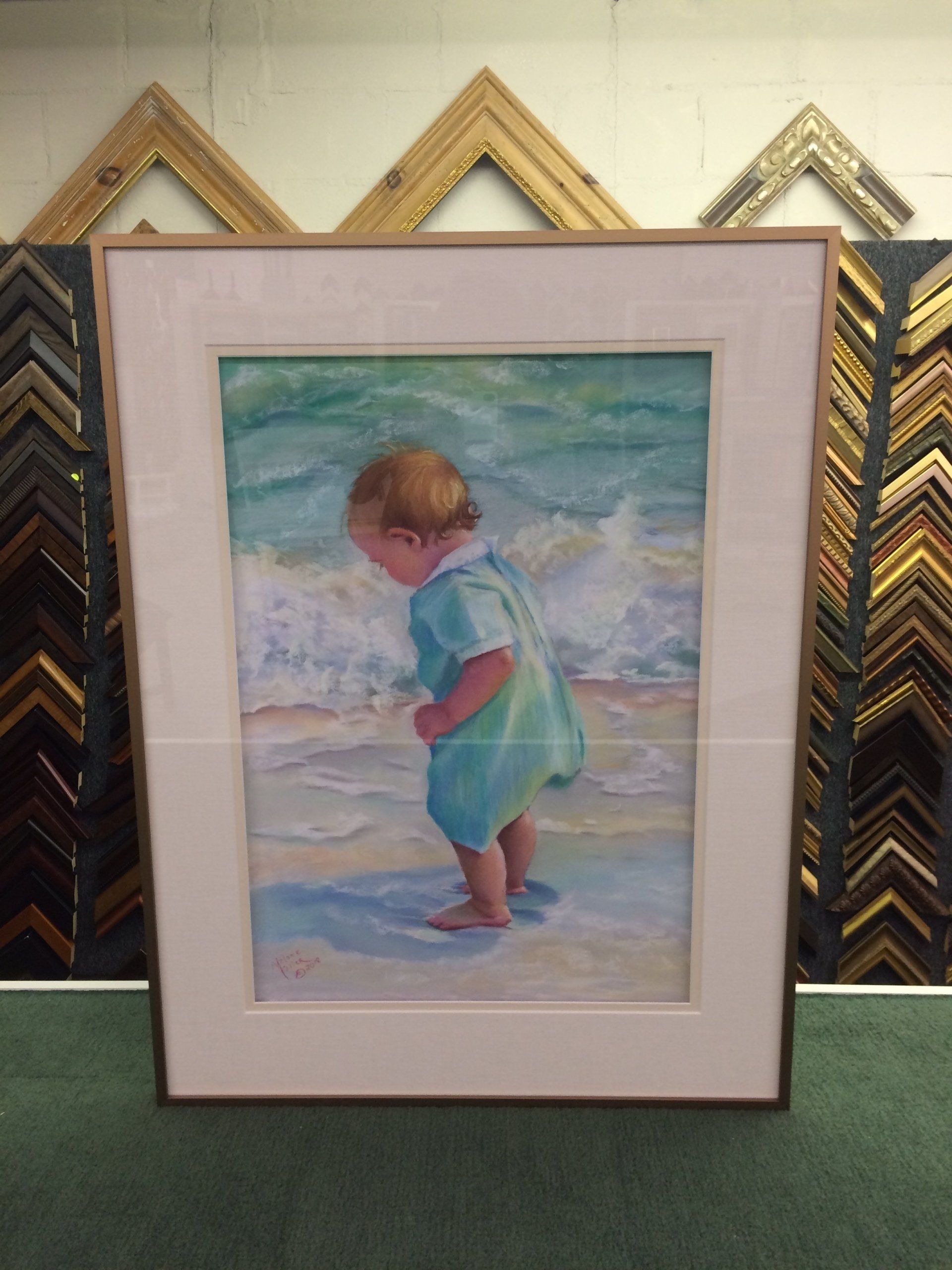 framed painting of child