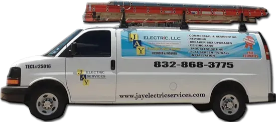 White electrician service van with ladder rack and blue business graphics, parked side view