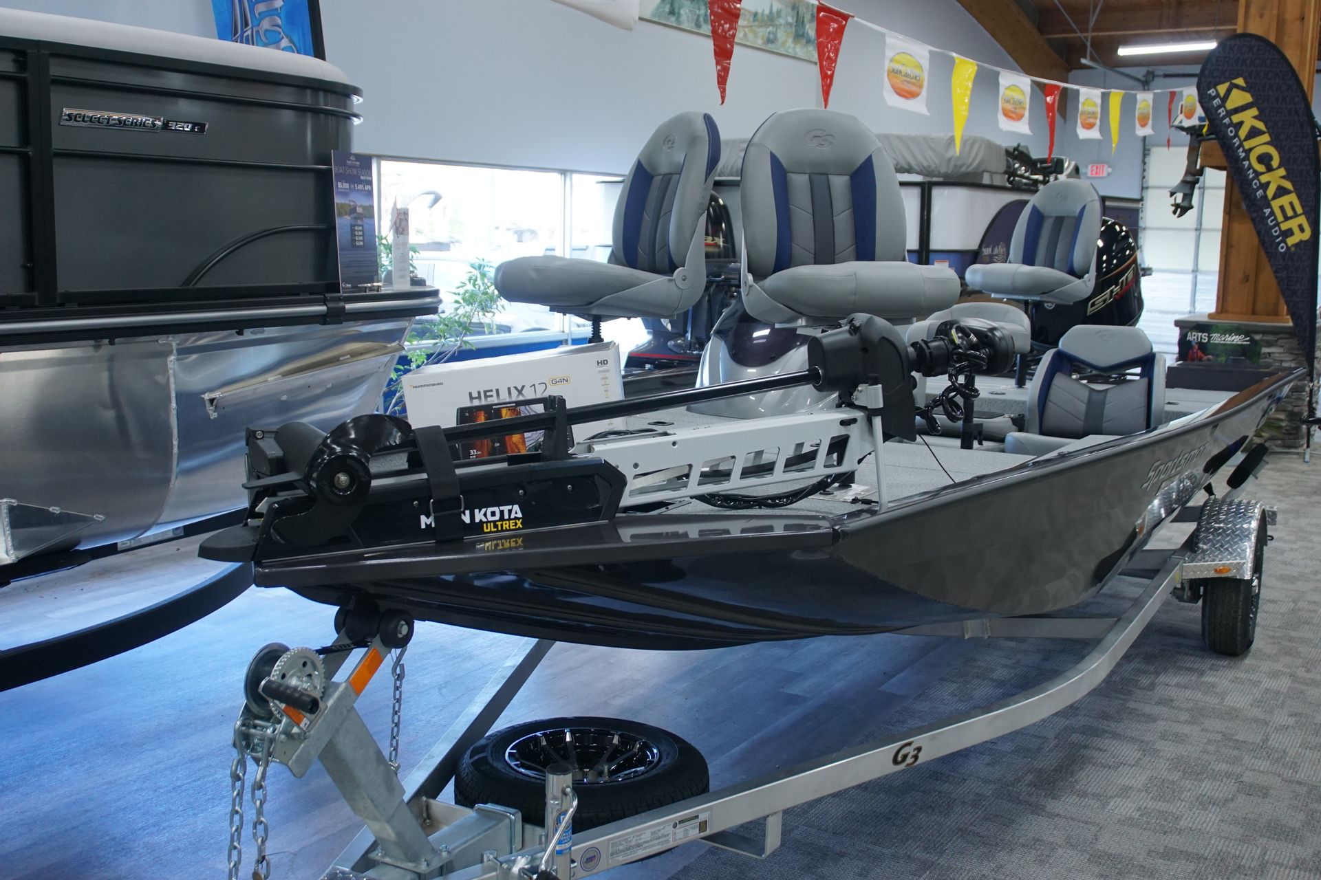 A boat is sitting on a trailer in a showroom.