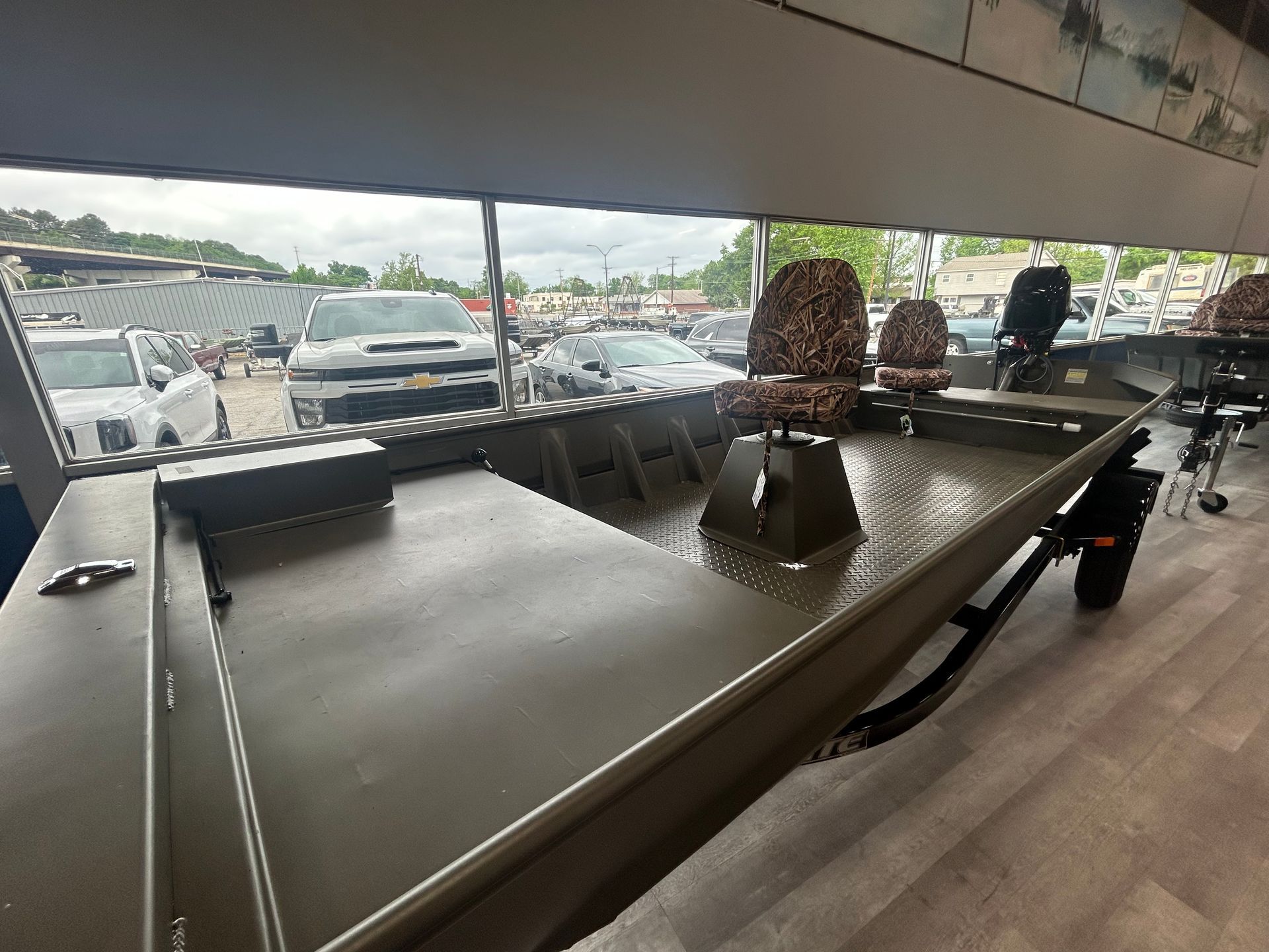 Billiards table under a canopy with parking lot and cars visible in the background