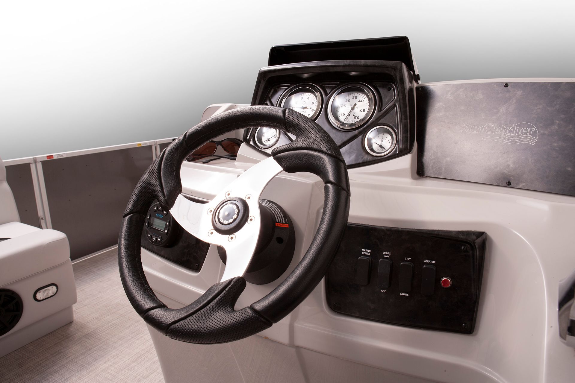 A close up of a steering wheel on a boat
