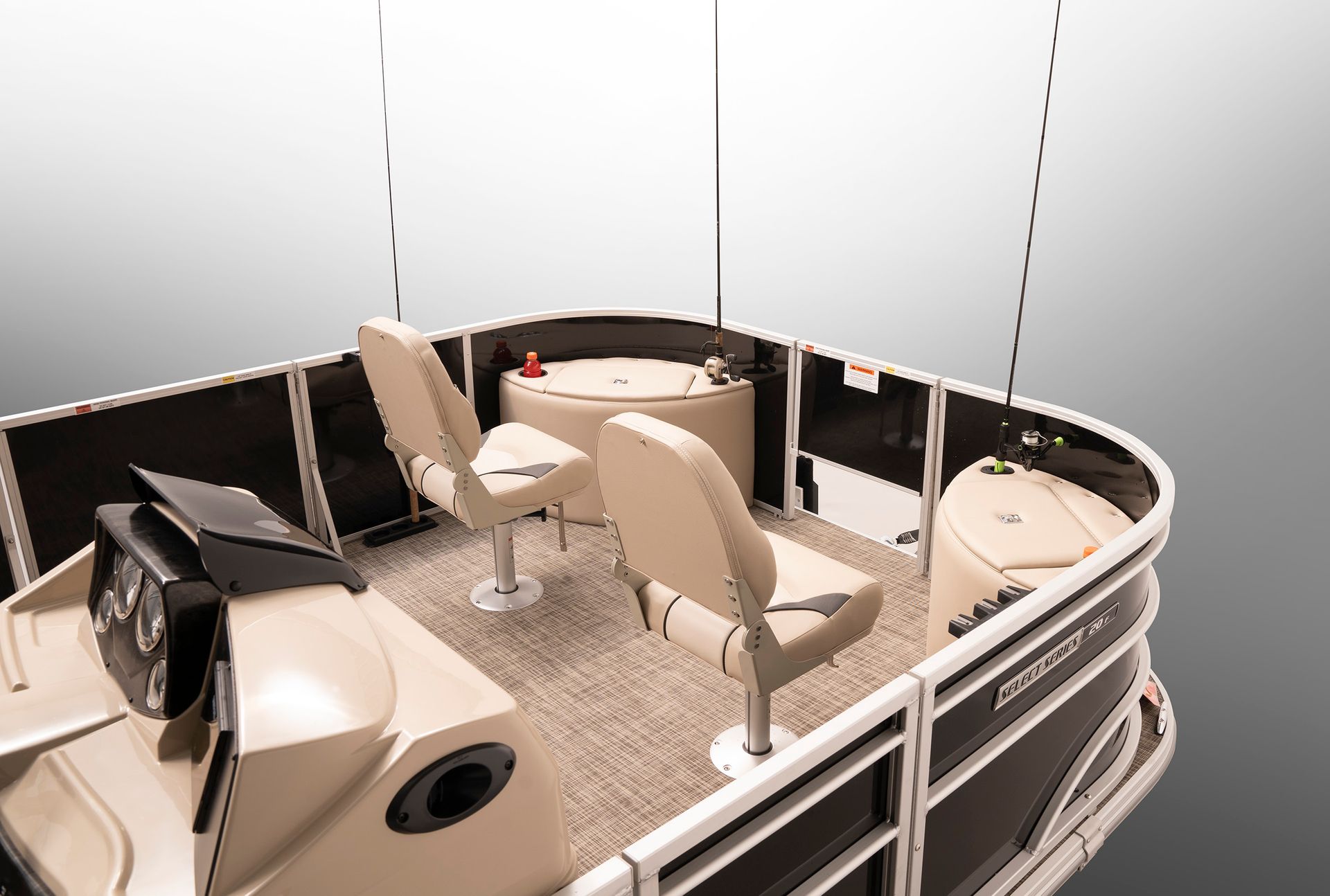 The inside of a pontoon boat with a table and chairs.