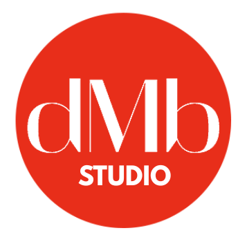 Red circle with "dMb" in white lettering above "STUDIO".