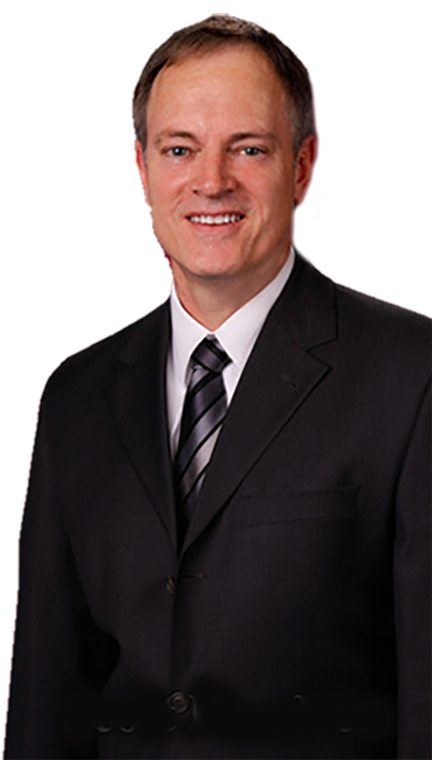 A man in a suit and tie is smiling for the camera.