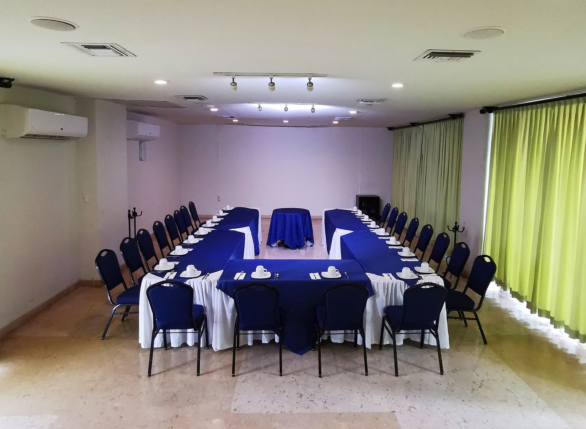 A conference room with a long table and chairs