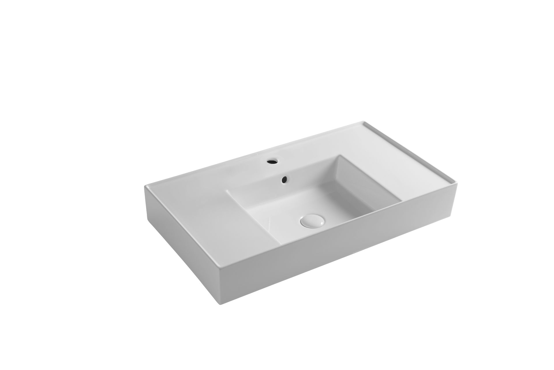 Lavandino da bagno rettangolare in ceramica bianca con rubinetto e piano laterale.