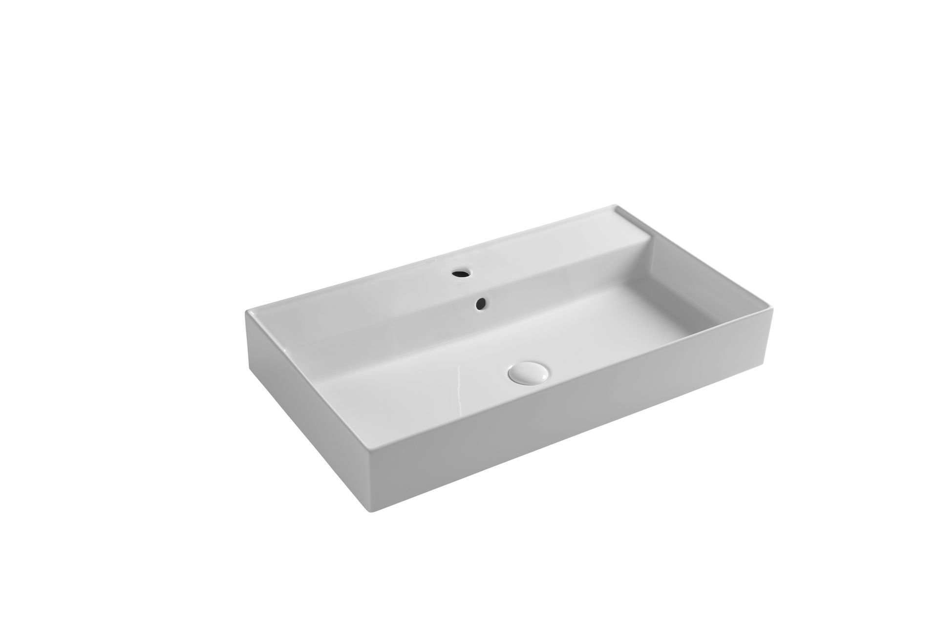 Lavandino rettangolare bianco per il bagno con rubinetto e fori di scarico.