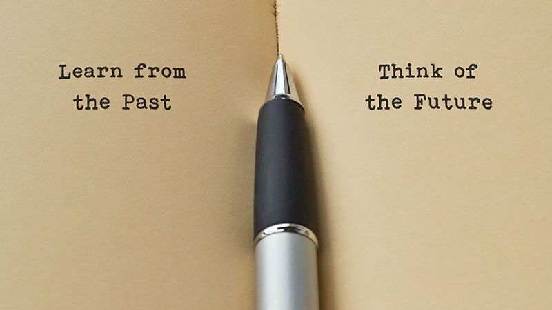 two pages of a book separated by a pen