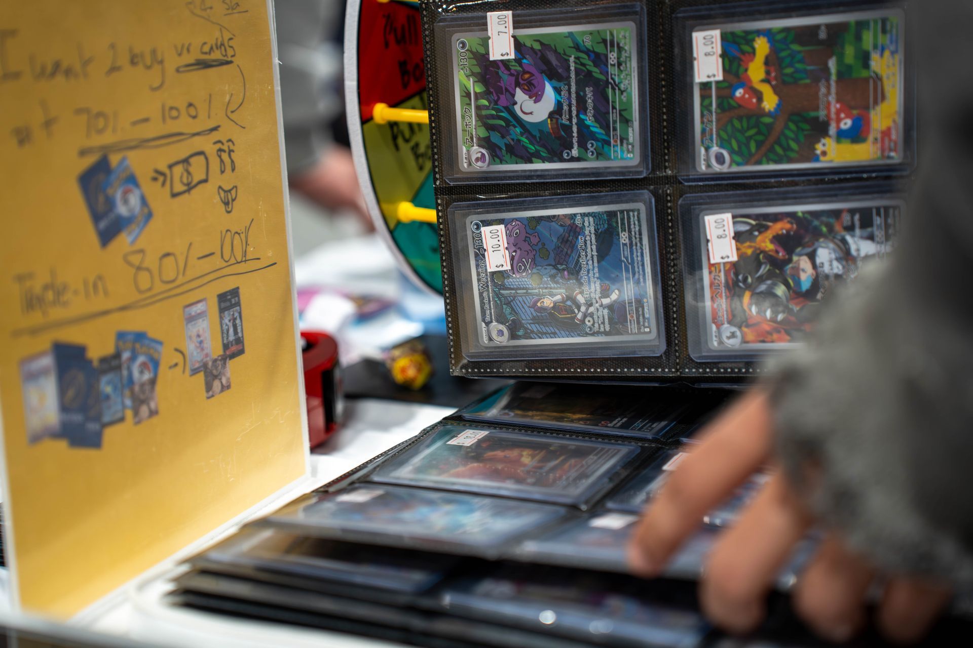 attendee looking through a pokemon binder