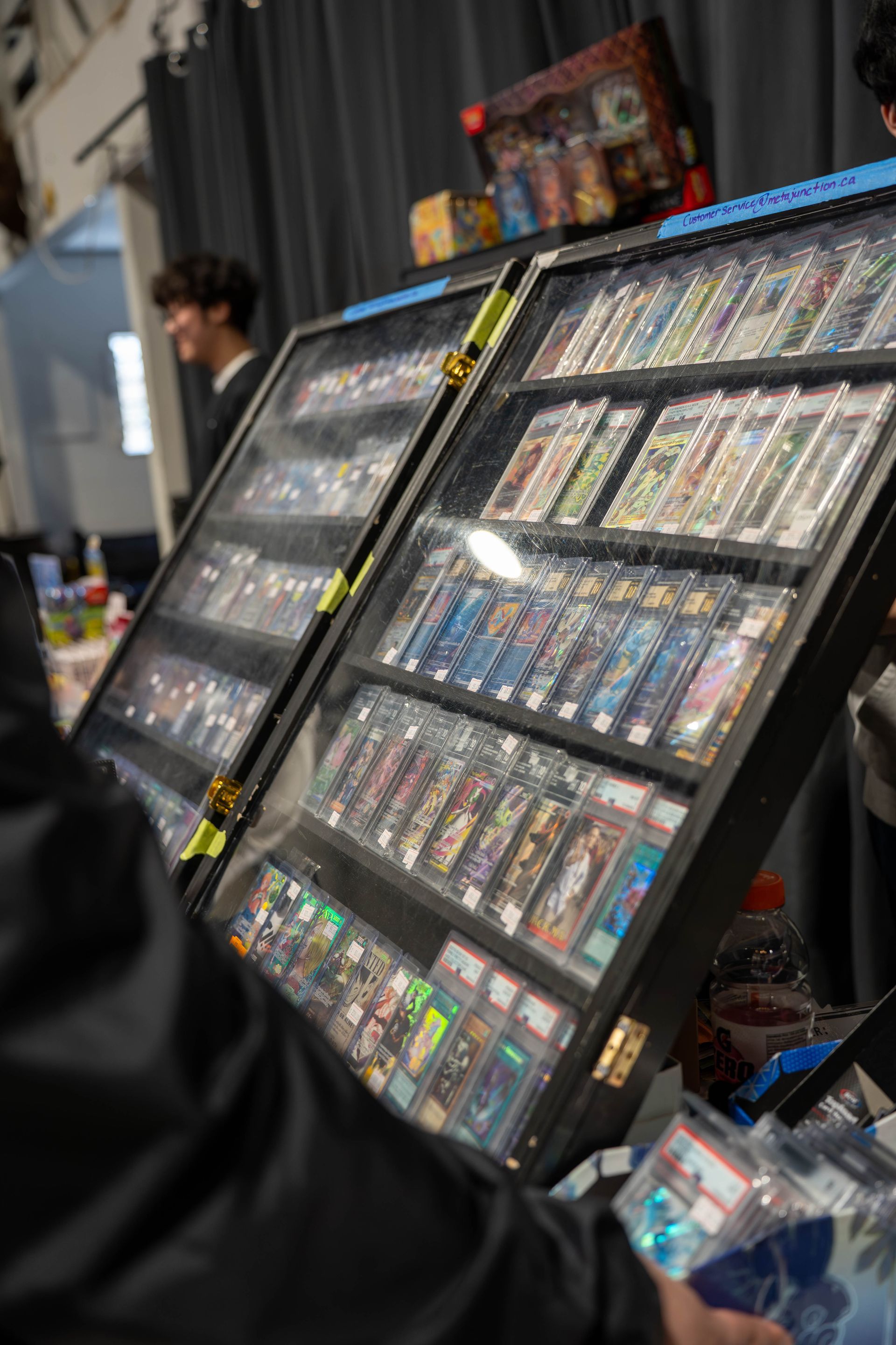 slabbed pokemon cards in display cases