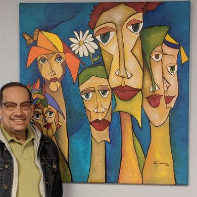 Diversity Painting a person standing beside a painting