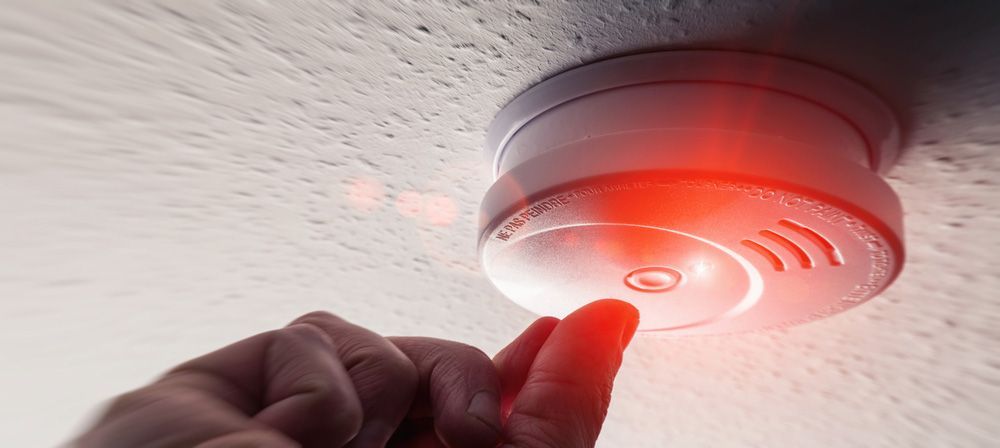 Person Activating a Fire Alarm Button - Hunter Valley NSW