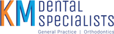 The logo for KM Dental Specialists.