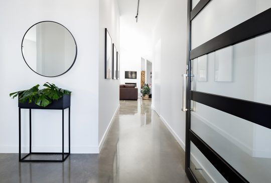 A Hallway With A Mirror And A Plant On A Table — Pigot's Midwestern Mini Mix In Orange, NSW