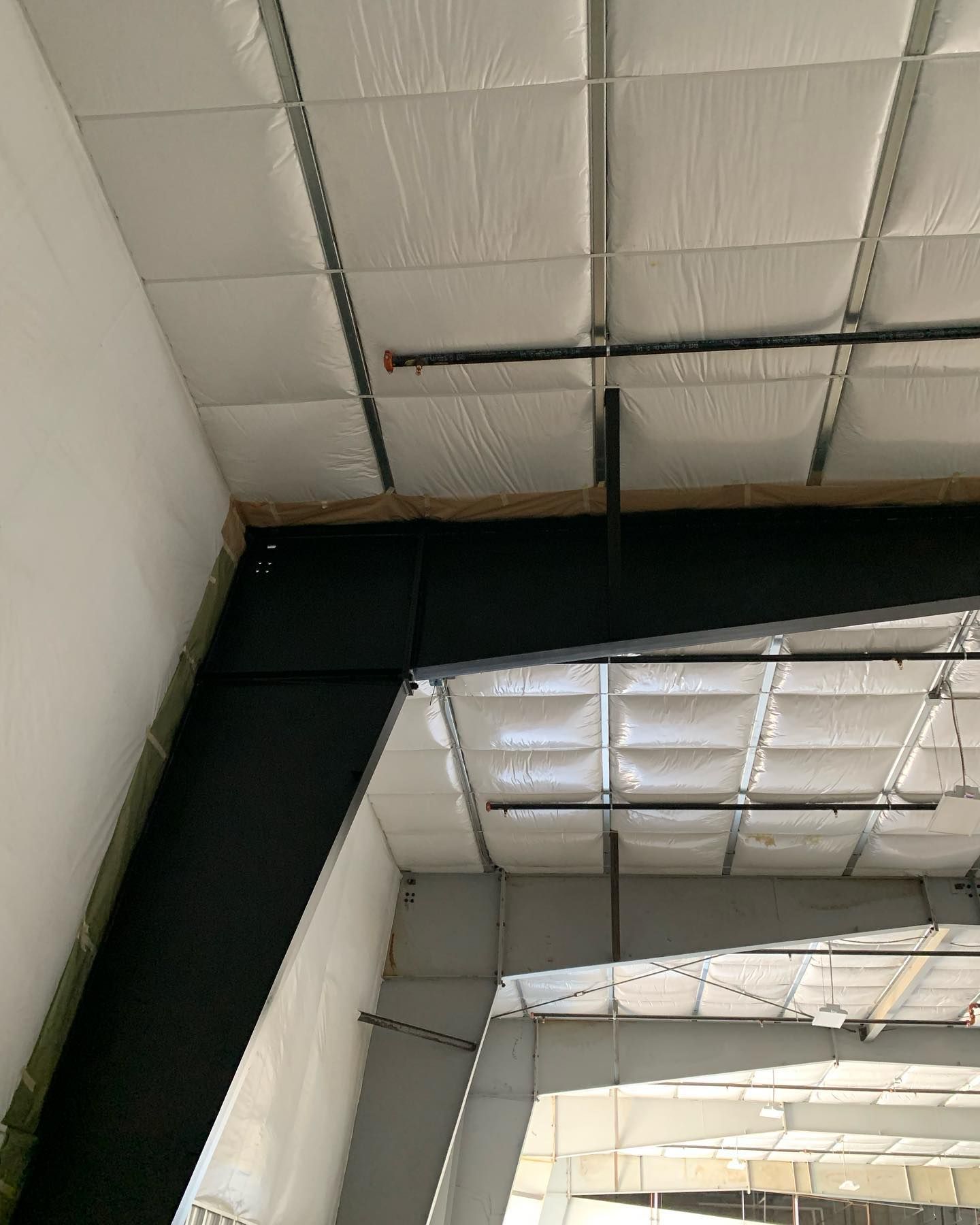 A large building with a ceiling that is covered in insulation.