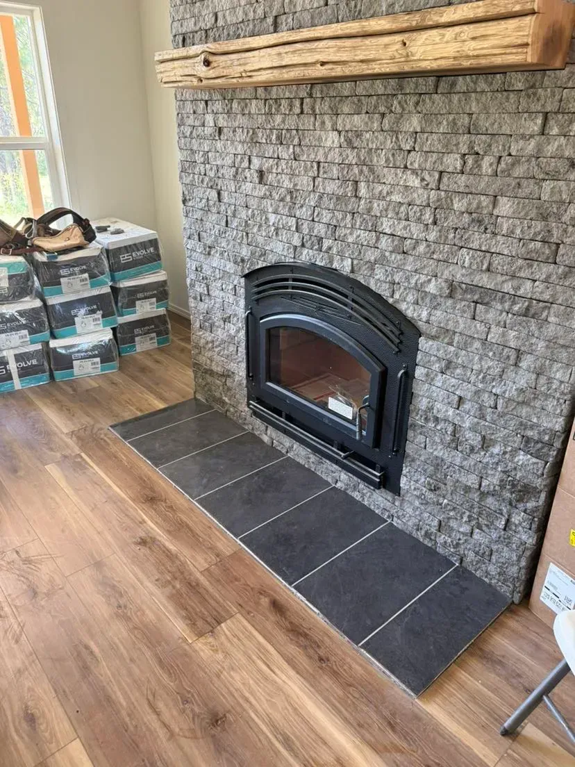 There is a fireplace in the middle of the room.