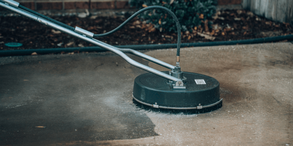 Close up pressure washing drive way