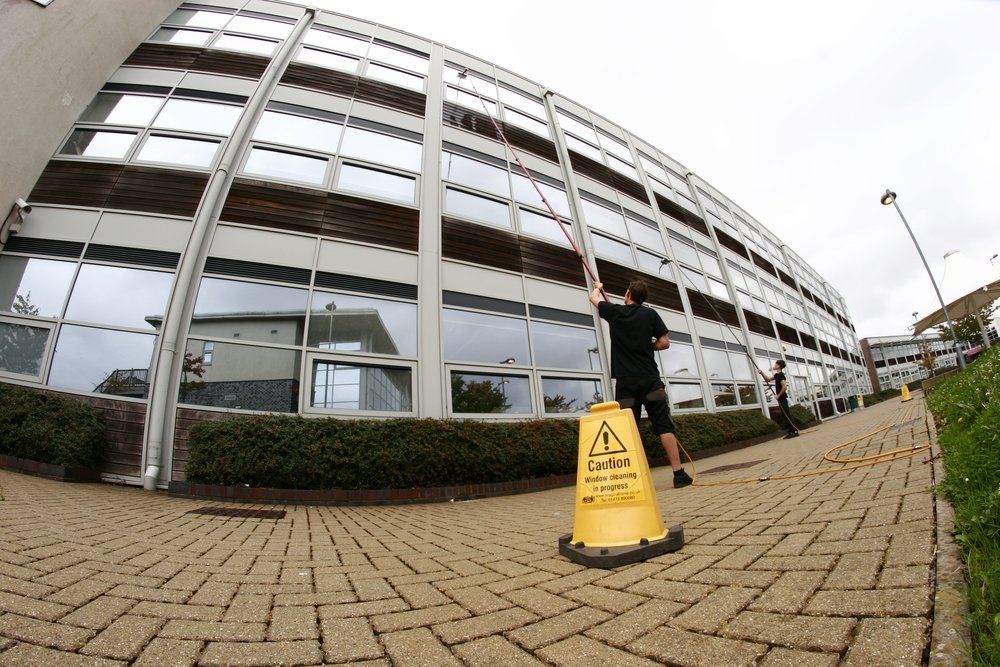 Corporate office building window getting cleaned