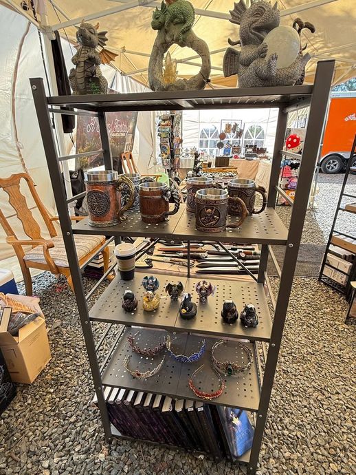 Tiered jewelry display rack with bracelets and small accessories in an indoor market stall