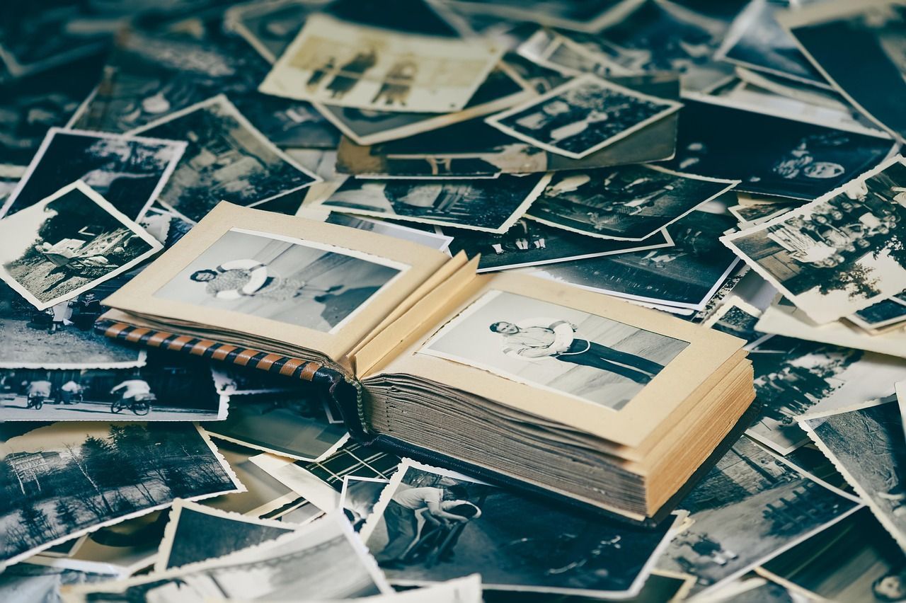Photo album, on top of several polaroids
