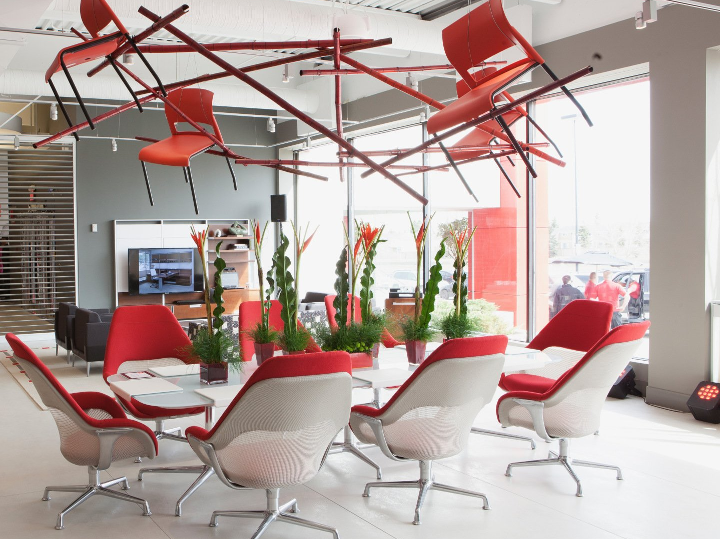A room with red and white chairs and tables