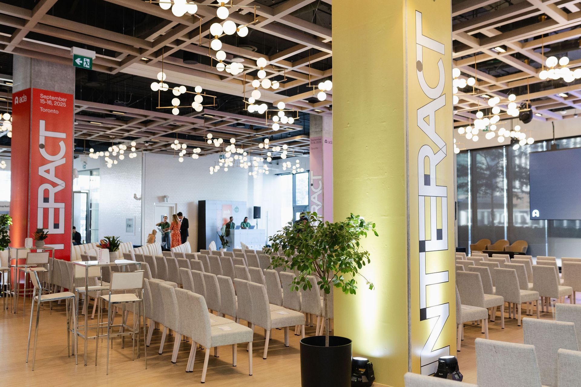 Event space with rows of chairs, columns saying 