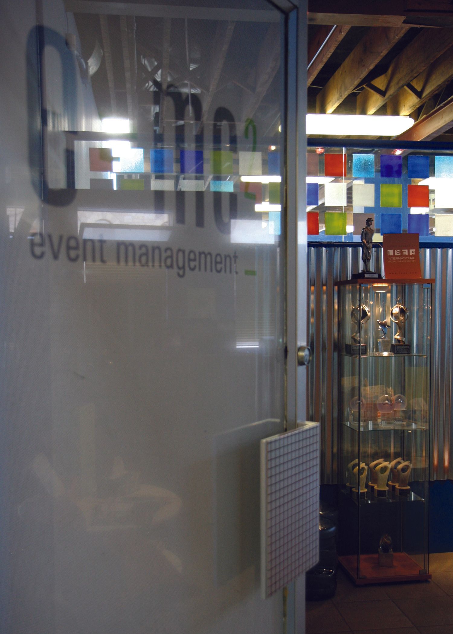 A glass door with the word event management on it