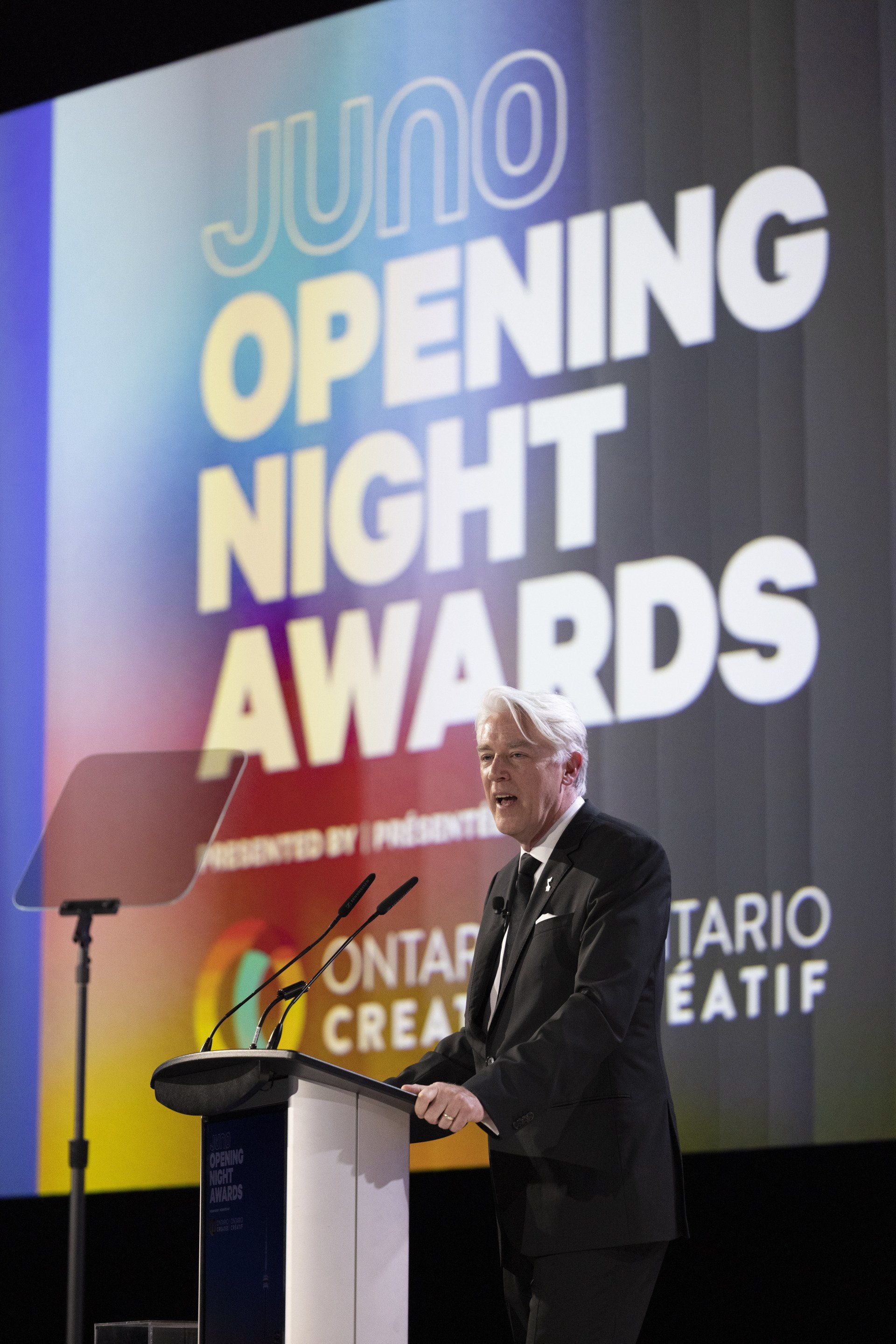 A man is giving a speech at the juno opening night awards