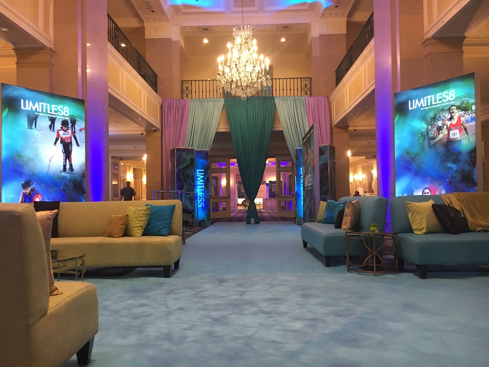 A large room with a lot of furniture and a chandelier.