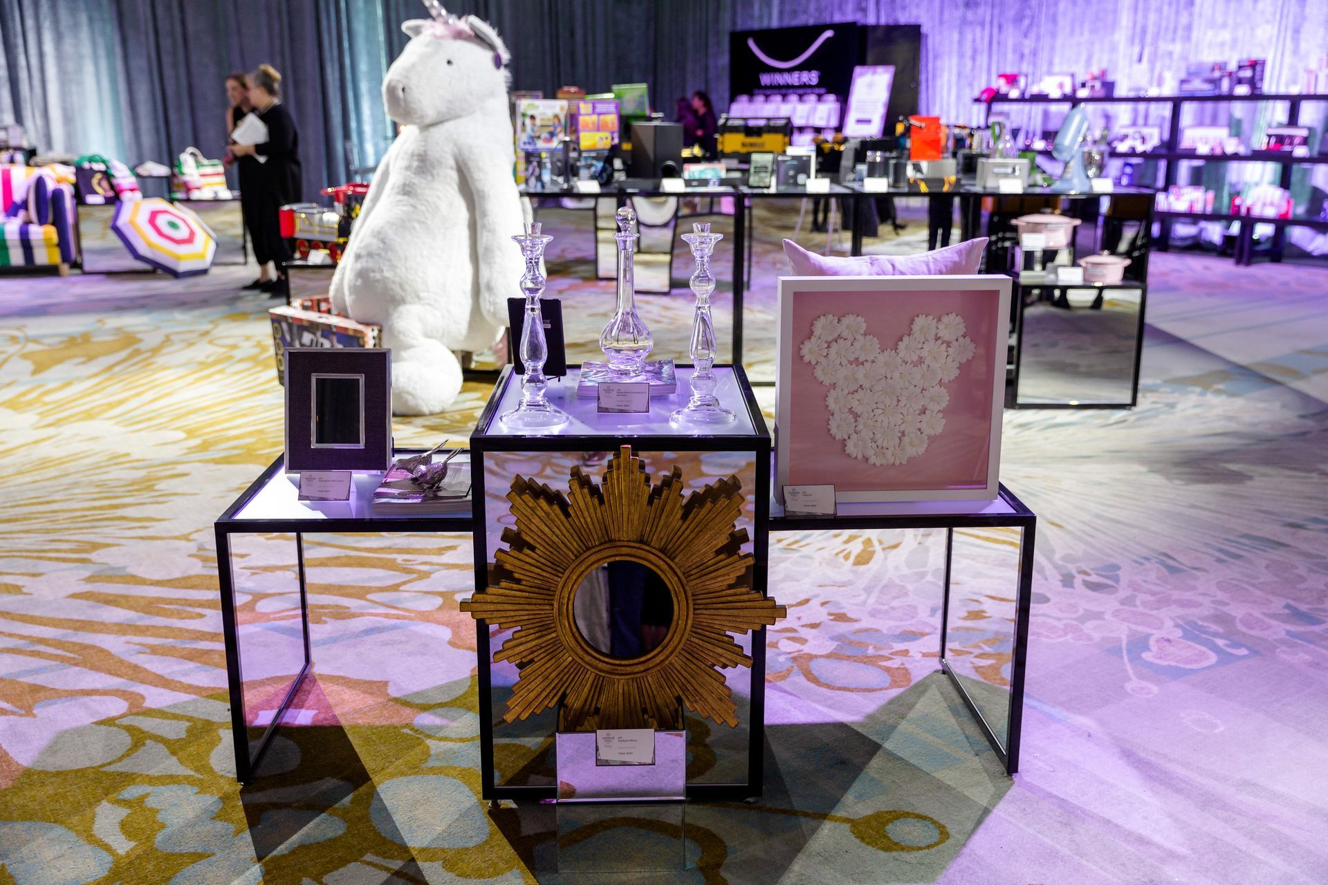 A room filled with lots of tables and decorations.
