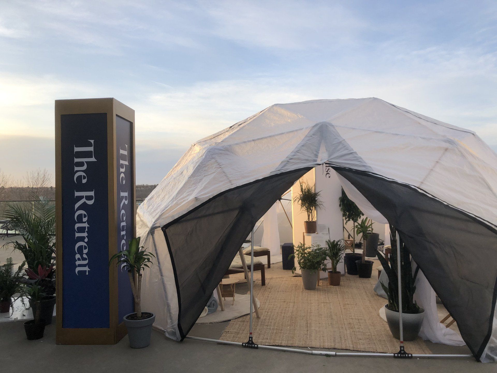 A tent with a sign that says the retreat on it
