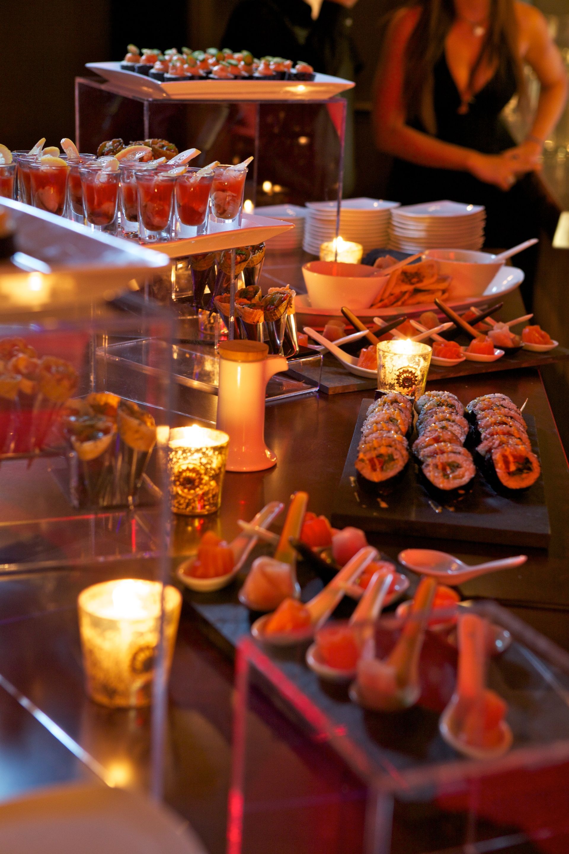 A table with a lot of food and candles on it