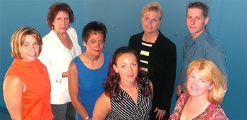 A group of people are posing for a picture together