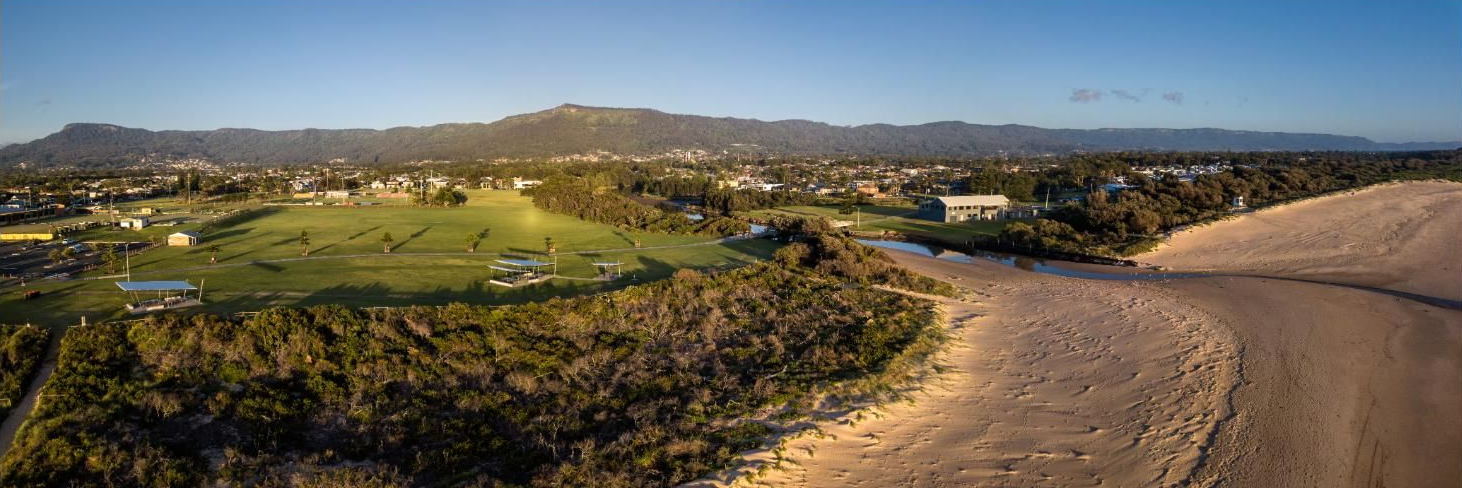 An Aerial View Of A Field With Trees And A Dirt Road — APEX Painting & Maintenance In Corrimal, NSW